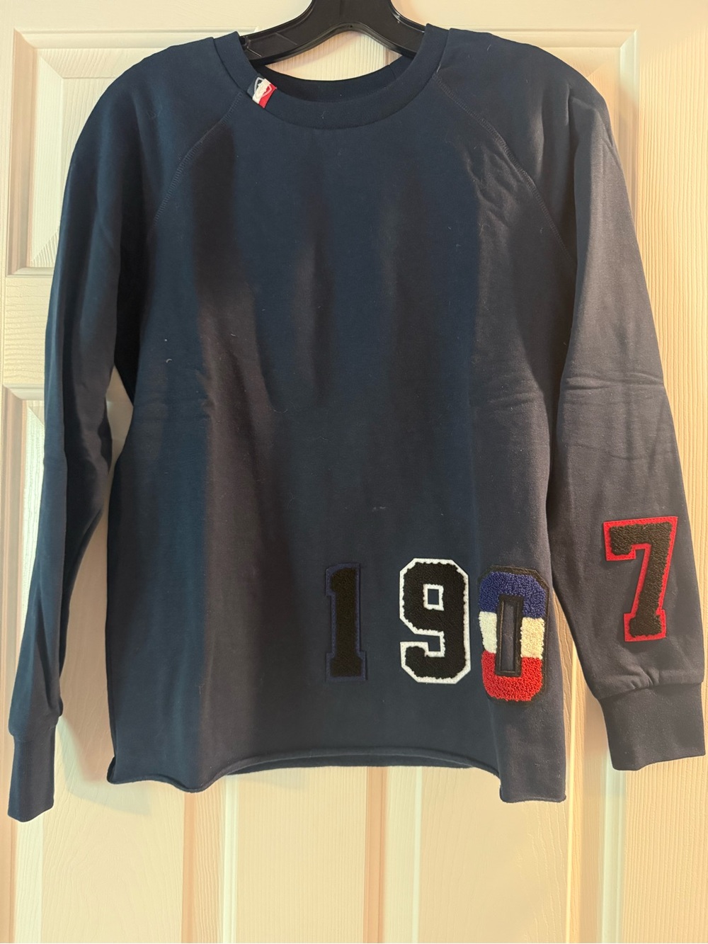 Rossignol Navy Sweatshirt with Red and White Logo Patch
